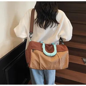 Large capacity travel duffel bag for women, stylish lightweight shoulder gym bag for trips.