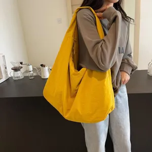 Large capacity solid color yellow tote bag for women, casual lazy style slouchy shoulder bag.