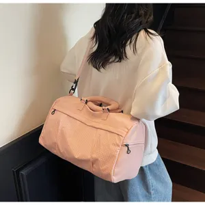 Pink grid travel duffel bag for women, lightweight portable sports fitness shoulder bag.