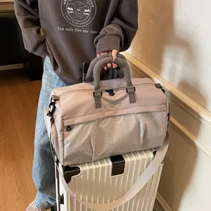 Large capacity travel duffel bag for women, stylish lightweight crossbody fitness bag for short trips.