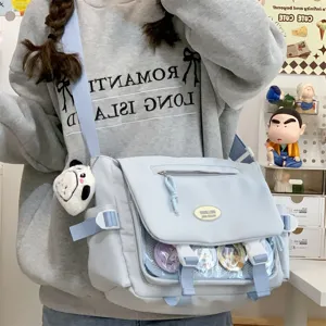 Cute Japanese style student messenger bag with transparent window for pins and badges.