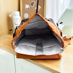 Casual colorblock backpack with large capacity, drawstring closure and laptop compartment for travel.
