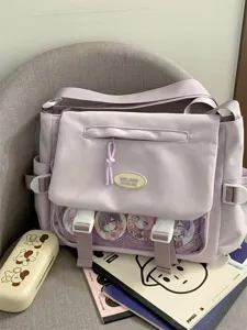 Kawaii student style purple canvas messenger bag with clear ita bag window and anime pins.