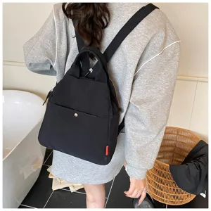 Black casual backpack for women, multi-functional travel daypack with top handle and daily use.
