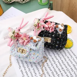 Cute kids tweed shoulder bag with plush bunny and flower decor for little girls.