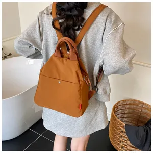 Detailed back view of a stylish casual commuter backpack in daily use setting.
