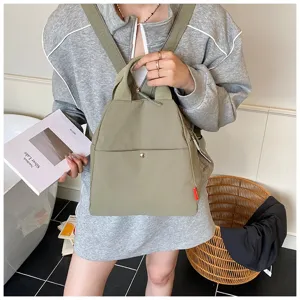 Casual multi-functional green backpack for women, stylish daily commuter and travel bag.