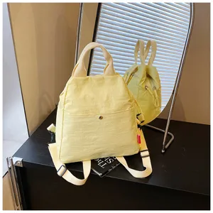 Casual candy yellow nylon backpack, versatile commuter daypack with adjustable shoulder straps.