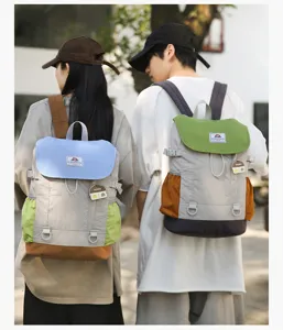 Detailed view of the color-blocked casual backpack showcasing multi-compartment design and durable straps.