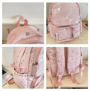 Pink star pattern itabag detail view featuring transparent pockets, zippers and adjustable side straps.