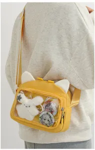Cute anime ita bag for women, yellow canvas crossbody shoulder bag with cat ears and display window.