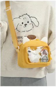 Cute Japanese style cat ear canvas ita bag, transparent pocket crossbody shoulder bag for anime fans.