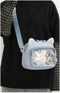 Cute Japanese anime ita bag with cat ears and clear front pocket for badges and plushies.