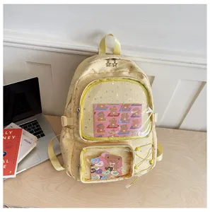Clear front ita backpack detail showing cute bear insert card, yellow star print and spacious design.