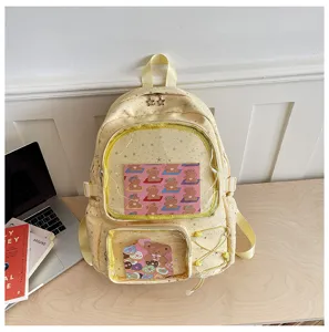 Yellow ita backpack with clear front pocket, cute star pattern, ideal for pins display.