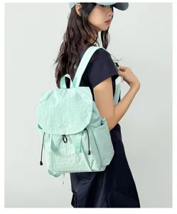 Detailed view of a light green ultra-lightweight casual backpack, perfect for outdoor travel and daily use.