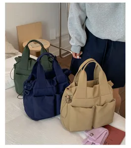 Casual nylon tote bag for women, large capacity shoulder bag and handbag for daily commute and school use.