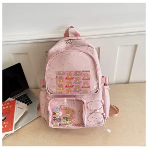 Detailed view of pink star pattern ita backpack with clear window display and cute bear inserts.