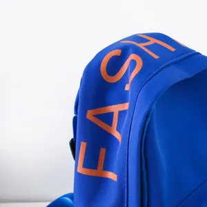 Detail shot of blue kids chest bag strap featuring stylish orange letter print design.