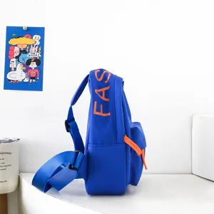 Blue kids chest bag side view detail with orange zipper and FAS letter print on fabric surface.