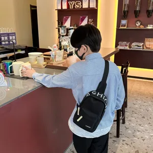 Kids black chest bag stylish shoulder crossbody bag featuring white fashion letter print detail