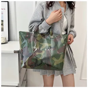 Detail shot of the waterproof PVC camo tote bag showing large capacity and sturdy handles.