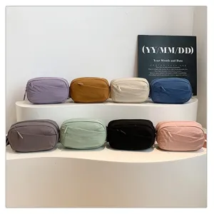 Multicolor nylon waist bag detail, casual crossbody chest bag for outdoor travel.