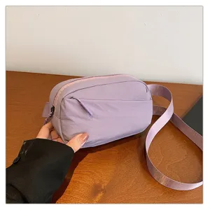 Stylish purple nylon belt bag for women men, casual chest pack crossbody bag for outdoor travel.