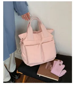 Pink nylon tote bag for women, large capacity shoulder bag, casual school handbag for daily use.