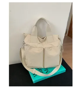 Casual nylon tote bag for women, large capacity shoulder and crossbody bag with pockets.