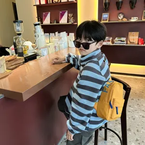 Kids stylish yellow crossbody chest backpack with cool blue letters for boys daily use.