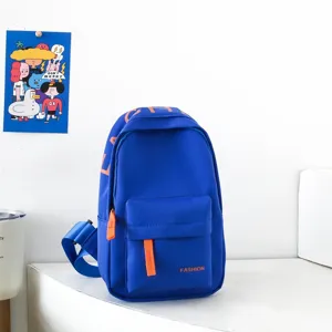 Detail view of stylish kids blue chest bag with vibrant orange zippers and casual daily design.