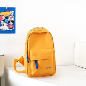 Yellow kids chest bag detail, trendy casual crossbody sling backpack with front pocket feature.