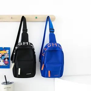 Detail view of trendy children canvas chest sling bags featuring dual color options.