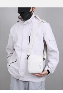 Minimalist solid color mini shoulder bag for men, casual outdoor crossbody mobile phone bag.