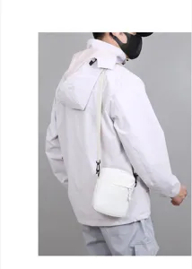Detail view of the white minimalist crossbody bag showcasing its compact casual daily design.