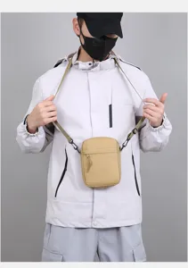 Minimalist men's solid color mini shoulder bag, casual crossbody phone bag for daily use.