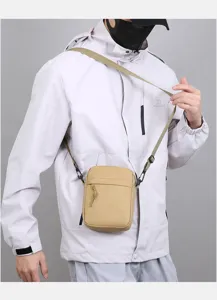 Casual solid color mini cross-body bag for men, lightweight daily shoulder phone bag.