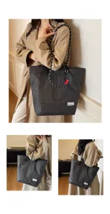 Detailed view of the black checkered nylon tote bag with climbing rope handles, showcasing style.