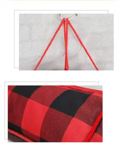 Detailed view of the Christmas door draft stopper with red black plaid fabric and hanging strings.