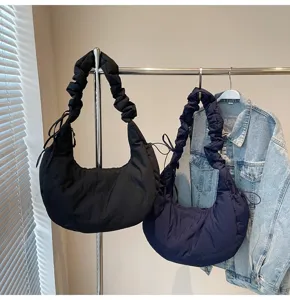 Nylon dumpling shoulder bag detail, casual large capacity cloud hobo bag for women daily commute.