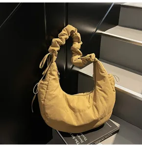 Khaki nylon pleated dumpling bag, cloud shoulder bag with gathered strap and stylish design.