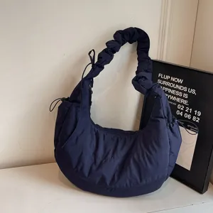 Dark blue nylon hobo bag for women, casual commuter dumpling crossbody bag with slouchy strap.