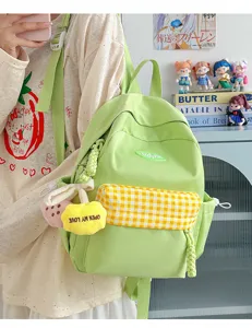 Casual stylish mini canvas backpack for women, cute green school bag with plaid pocket.
