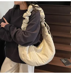 Cream nylon hobo shoulder bag detail, casual large capacity cloud dumpling bag style.