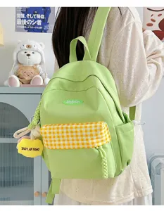 Cute avocado green mini backpack with plaid front pocket, stylish daily casual bag detail.