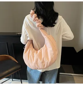 Casual pink nylon cloud shoulder bag detail view, soft pleated strap and spacious daily design.
