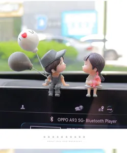 Cute cartoon couple resin figurine for car dashboard decoration and interior creative display.