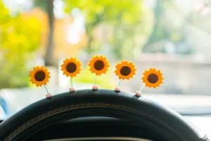Cute shaking sunflower car ornament detail, fresh flower car dashboard decor close up