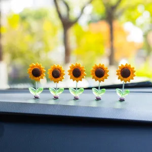 Cute bobblehead sunflower car dashboard ornament, fresh floral interior decoration for auto.